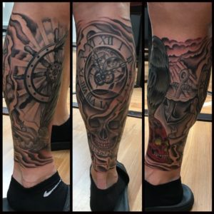 Memorial Tattoo of a raven with a clock and helm on a mans leg