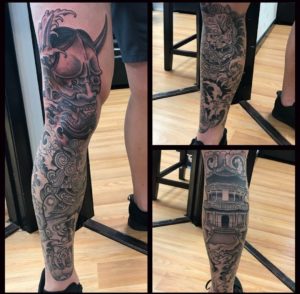 Traditional Japanese Foo dog with temple and finger waves as a full black and gray leg sleeve